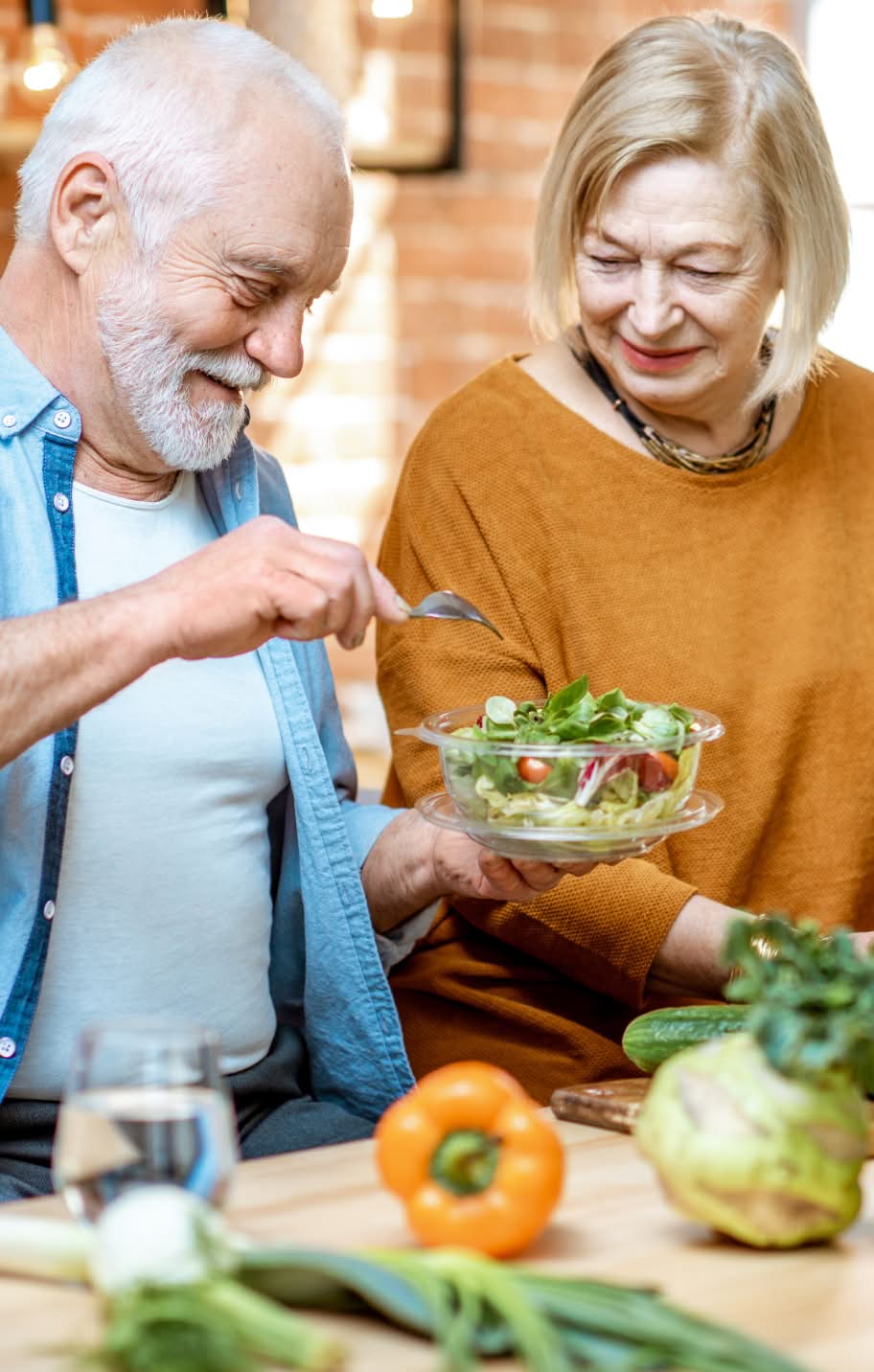 Couple making a salad