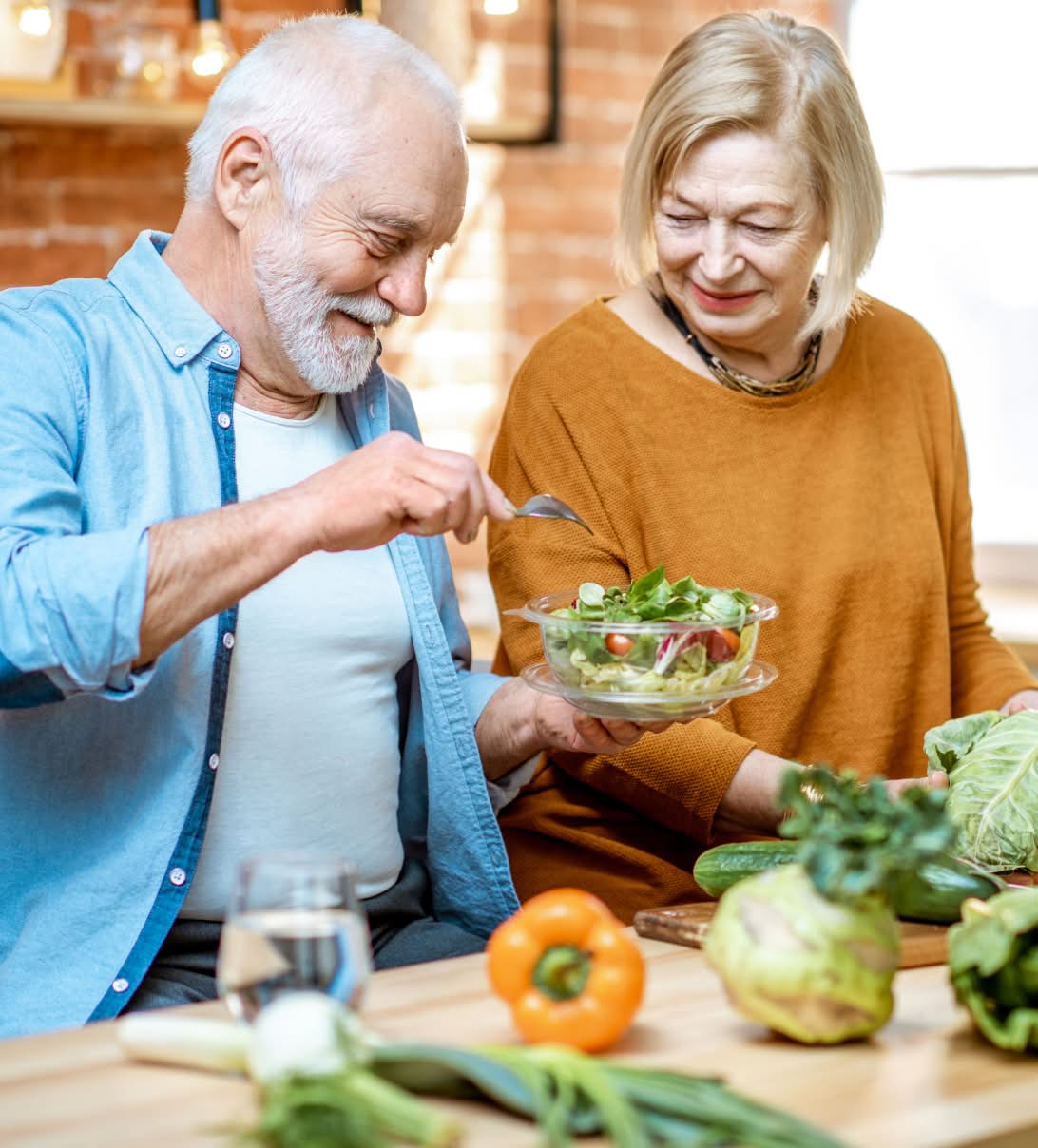 Couple making a salad